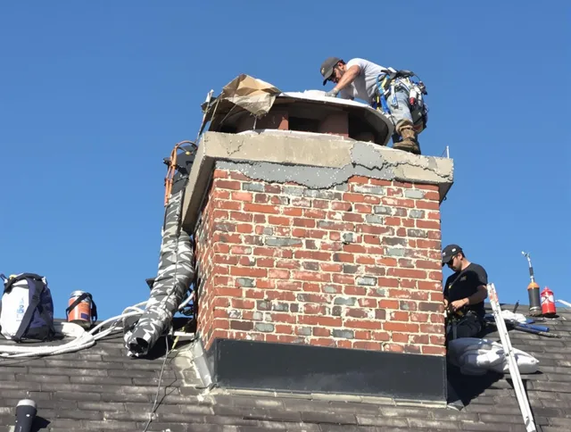 Richmond Heights Chimney Sweep installing a custom chimney crown in Richmond Heights, OH