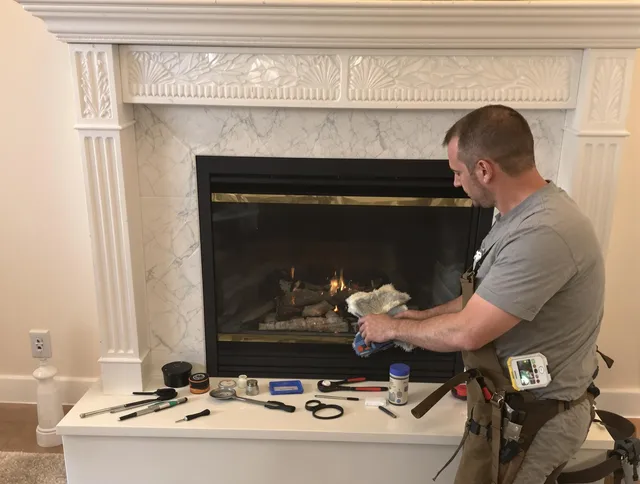 Richmond Heights Chimney Sweep performing fireplace maintenance in Richmond Heights, OH