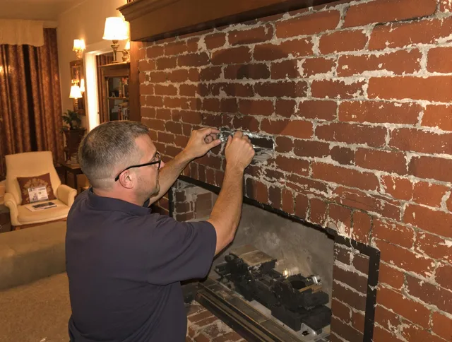 Richmond Heights Chimney Sweep expert fixing a fireplace in Richmond Heights, OH